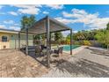Backyard oasis features a pool, pergola with seating, and lush landscaping at 6708 11Th Nw Ave, Bradenton, FL 34209