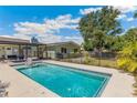 Private backyard pool with lounging area and lush landscaping for a serene retreat at 6708 11Th Nw Ave, Bradenton, FL 34209