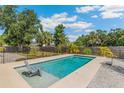 Sparkling backyard pool offers a refreshing escape with surrounding landscaping at 6708 11Th Nw Ave, Bradenton, FL 34209