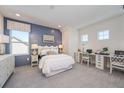 Stylishly decorated bedroom with a shiplap accent wall, decorative bedside tables and a built-in desk area at 721 Anegada Ln, Sarasota, FL 34234