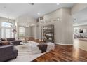 Open-concept living room with stylish decor, hardwood floors, neutral walls, and plenty of seating at 7626 Double Pine Dr, Sarasota, FL 34240