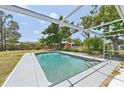 Exterior view of a fenced in pool with concrete pool deck at 920 Myrtle Ave, Venice, FL 34285