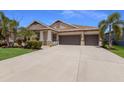 Lovely home with a three-car garage and beautiful landscaping at 11513 11Th E Ave, Bradenton, FL 34212