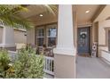 Inviting front porch with comfortable seating area and neutral color palette at 11513 11Th E Ave, Bradenton, FL 34212