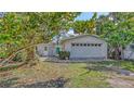 Charming single-story home with a two-car garage and a well-maintained front yard at 120 Hammock Rd, Anna Maria, FL 34216