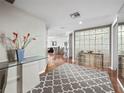 Inviting foyer with tiled floor, glass block wall, and decorative accents, providing a warm welcome at 2120 Harbourside Dr # 617, Longboat Key, FL 34228