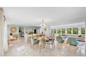 Bright, open-concept living and dining area with stylish furnishings and waterfront views at 306 68Th St, Holmes Beach, FL 34217