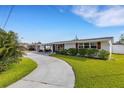 Lovely home with a well-kept lawn and an inviting driveway, perfect for easy access and showcasing its charm at 3219 Florida Blvd, Bradenton, FL 34207