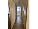 Hallway with closet and bath featuring tile floor at 4035 S School Ave # D3, Sarasota, FL 34231