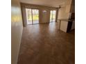 Open-concept living area features neutral tile floors and access to outdoor living spaces at 4035 S School Ave # D3, Sarasota, FL 34231