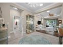 Elegant foyer showcasing tile flooring and an open layout leading to the living areas at 4542 Cedar Brush Ter, Sarasota, FL 34243