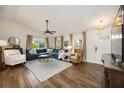 Inviting living room featuring hardwood floors, large windows, and comfortable seating, perfect for relaxation at 5204 24Th E Ave, Palmetto, FL 34221