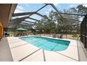 Enjoy outdoor living with a beautiful screened-in pool area, ideal for relaxation and entertainment at 5204 24Th E Ave, Palmetto, FL 34221