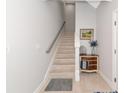 Bright stairway showcasing light wood floors, a neutral color palette, and stylish decorative accents at 5561 Cannes Cir # 5101, Sarasota, FL 34231