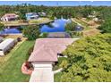 Beautiful aerial view of home featuring a large backyard screened-in lanai and gorgeous water views at 6011 91St E St, Bradenton, FL 34202