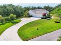 Gorgeous single-story home featuring a long driveway and lush landscaping, providing excellent curb appeal at 6102 9Th Avenue Cir Ne, Bradenton, FL 34212