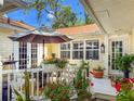 Inviting outdoor patio area with comfortable seating, decorative plants, and ample natural light at 6402 23Rd Avenue W Dr, Bradenton, FL 34209