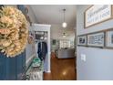 Welcoming entryway with a view into the open-concept living room, decorated with tasteful decor at 6503 32Nd W Ave, Bradenton, FL 34209