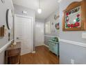 Inviting entryway with wood flooring and charming decor accents, creating a warm ambiance at 6503 32Nd W Ave, Bradenton, FL 34209