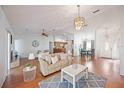 Open-concept living area featuring hardwood floors and contemporary decor at 6675 Easton Dr, Sarasota, FL 34238