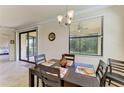 Charming dining area with natural light and access to the lanai at 6907 Grand Estuary Trl # 104, Bradenton, FL 34212