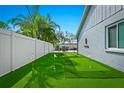 Enjoy outdoor recreation in this backyard with a mini golf putting green at 6909 34Th W Ave, Bradenton, FL 34209