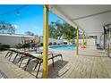 Beautiful pool with sun loungers and covered seating area, perfect for relaxation and entertaining at 6909 34Th W Ave, Bradenton, FL 34209