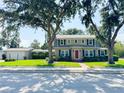 Beautiful two-story home featuring classic architecture, manicured landscaping, and a convenient detached garage at 708 32Nd W St, Bradenton, FL 34205