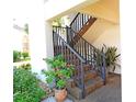 Staircase leading up to condos with nicely landscaped garden area at 802 Capri Isles Blvd # 231, Venice, FL 34292