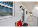 Inviting entryway featuring a tiled floor, a window, and the unit number, 204C at 116 Vista Hermosa Cir # 204C, Sarasota, FL 34242