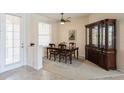 Formal dining area with classic furnishings, including a dark wood table and china cabinet at 12007 Clubhouse Dr, Lakewood Ranch, FL 34202