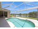 Enclosed pool with a gorgeous lake view, perfect for relaxation and entertainment at 12007 Clubhouse Dr, Lakewood Ranch, FL 34202