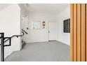 Modern entryway with staircase featuring unit number and sleek design at 174 Golden Gate Pt # 21, Sarasota, FL 34236