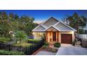 Cozy home with well-maintained landscaping, a charming entrance, and a side-entry garage at 1934 Bougainvillea St, Sarasota, FL 34239