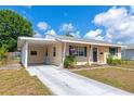 View of the home showcasing the side drive and carport at 2004 19Th W St, Bradenton, FL 34205