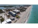 Stunning aerial view of beachside condos with beautiful Gulf views and beachfront access at 2400 N Beach Rd # 1, Englewood, FL 34223