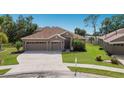 Charming single-story home with a well-manicured lawn and a convenient three-car garage at 4119 101St E Ave, Parrish, FL 34219
