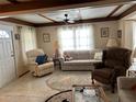 Cozy living room featuring an area rug, neutral colored walls, and comfortable seating at 5268 Boca Raton Ave, Sarasota, FL 34234