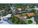 Aerial view of a waterfront property with a private dock and access to the bay at 681 Avenida De Mayo, Sarasota, FL 34242