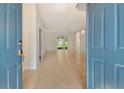 The home's spacious entryway features neutral tile floors and provides access to living areas at 7124 Rue De Palisades # 21, Sarasota, FL 34238