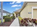 Charming single-Gathering home featuring a well-manicured lawn and covered entryway at 11835 Crawford Parrish Ln, Parrish, FL 34219