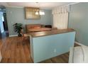 Dining room with a hardwood floor and wooden dining set at 1212 45Th E Ave, Ellenton, FL 34222