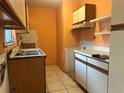Functional kitchen space with stainless steel sink, and tile flooring at 1905 Yale Ave, Bradenton, FL 34207
