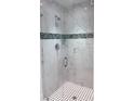 Modern bathroom featuring glass shower with stylish tile and updated fixtures at 2881 Pope St, North Port, FL 34287