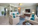 A beautifully staged living room with stylish furniture, neutral tones, and lots of natural light at 3600 Wisteria Pl, Punta Gorda, FL 33950