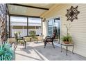 Relaxing covered porch with comfortable seating, perfect for enjoying the outdoors at 4119 13Th E St, Ellenton, FL 34222