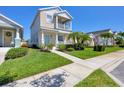 Inviting home with a manicured lawn and charming curb appeal, complemented by lush landscaping along the sidewalk at 4811 Woodbrook Dr, Sarasota, FL 34243