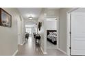 Long hallway features tiled flooring and access to the dining, living, and bedroom areas at 5111 11Th E St, Bradenton, FL 34203