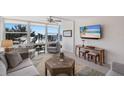 Living room with ocean view features comfortable seating and contemporary decor at 5200 Gulf Dr # 408, Holmes Beach, FL 34217
