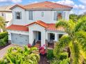 Charming two-story home with a tile roof, two-car garage, and beautiful landscaping at 5823 Title Row Dr, Bradenton, FL 34210